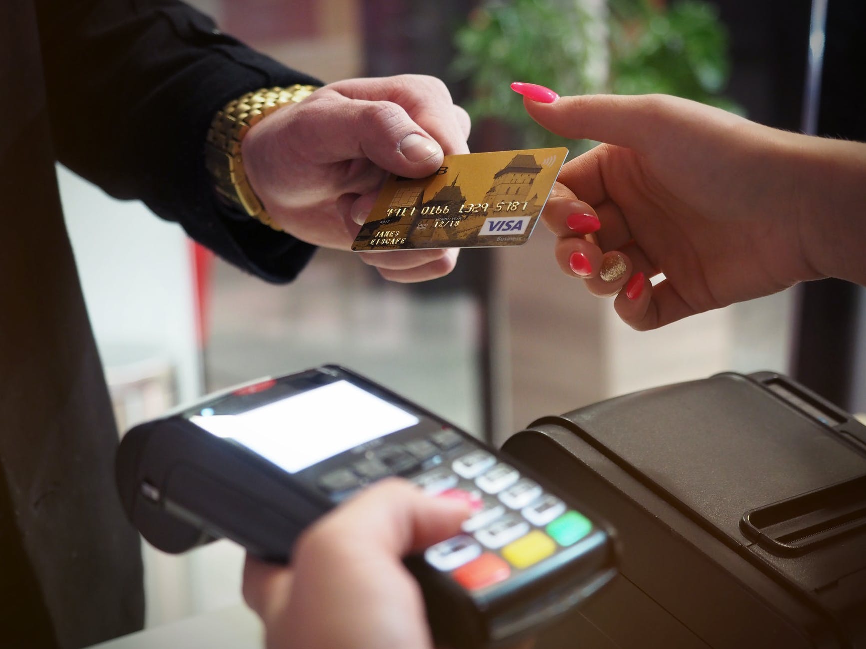 photo of person handing card